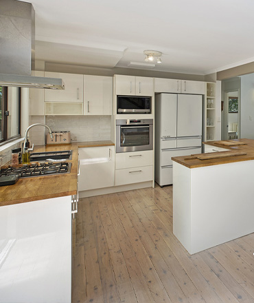 Main, roomy, modern kitchen provided by this Copacabana family holiday house make community cooking easy.